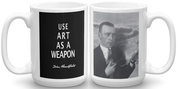 Famous political sloganan “Art As A Weapon” mug in The Official John Heartfield Exhibition Shop.